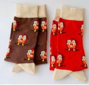 Chinese New Year Rooster Socks 1 Chinese New Year Rooster Socks Colorful rooster-themed socks displayed with festive Chinese New Year decorations.
